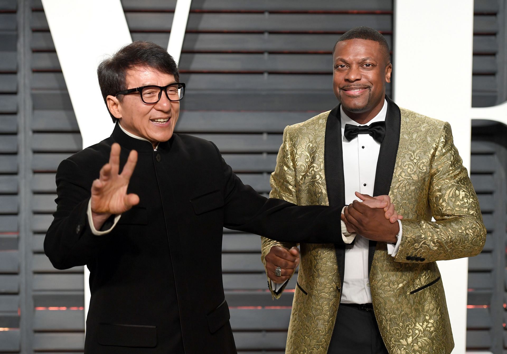 Jackie Chan and Chris Tucker arrive for the Vanity Fair Oscar Party hosted by Graydon Carter at the Wallis Annenberg Center for the Performing Arts on February 26, 2017, in Beverly Hills, California. (Image via Getty)